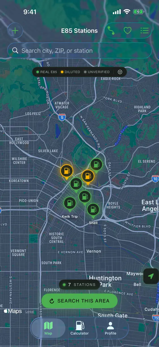 E85 App on iPhone showing the Ethanol Truth Map — a dark Los Angeles map with glowing green and amber fuel-pump pins marking verified E85 stations, a real-E85 / diluted / unverified legend, and a Search This Area button.